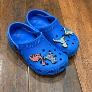 Blue Kids Crocs with Dino Charms. Size 10
